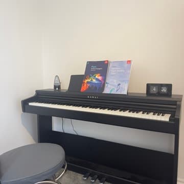 Piano studio at Bournemouth Music School -- Kawai piano with ABRSM grade books
